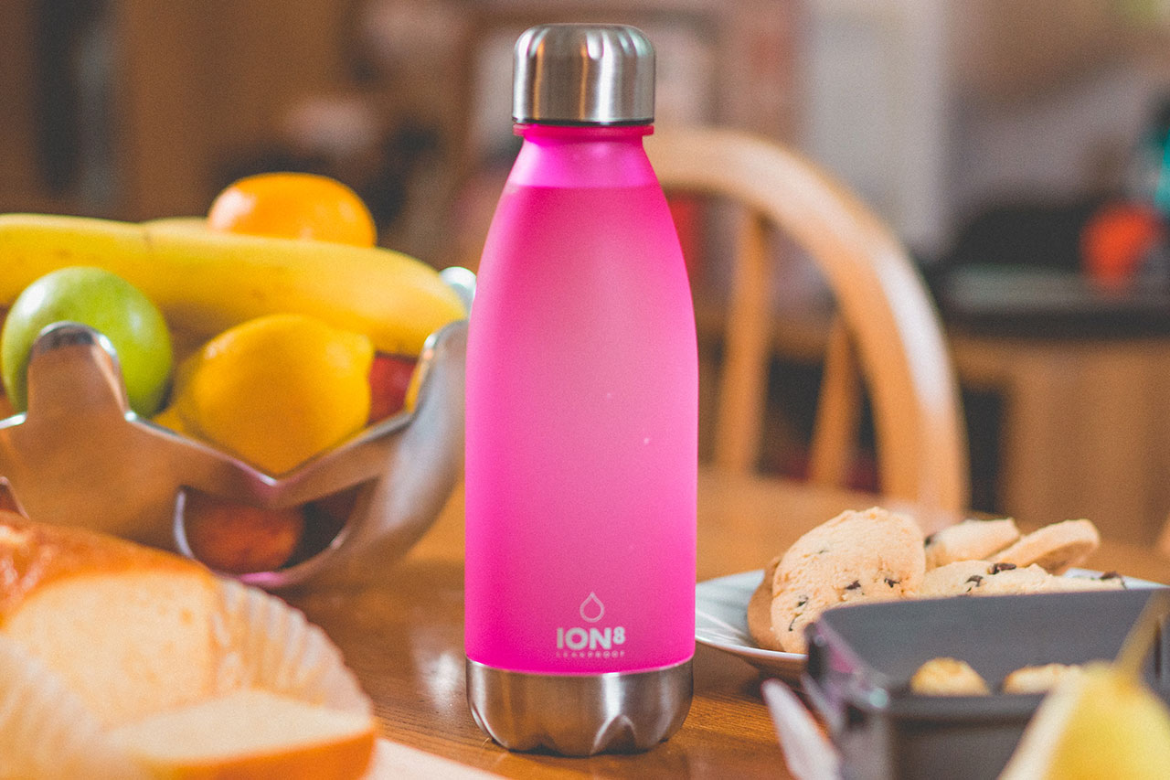 Swell Vacuum Insulated Stainless Steel Water Bottle Bikini Pink with matching cap 25 oz 